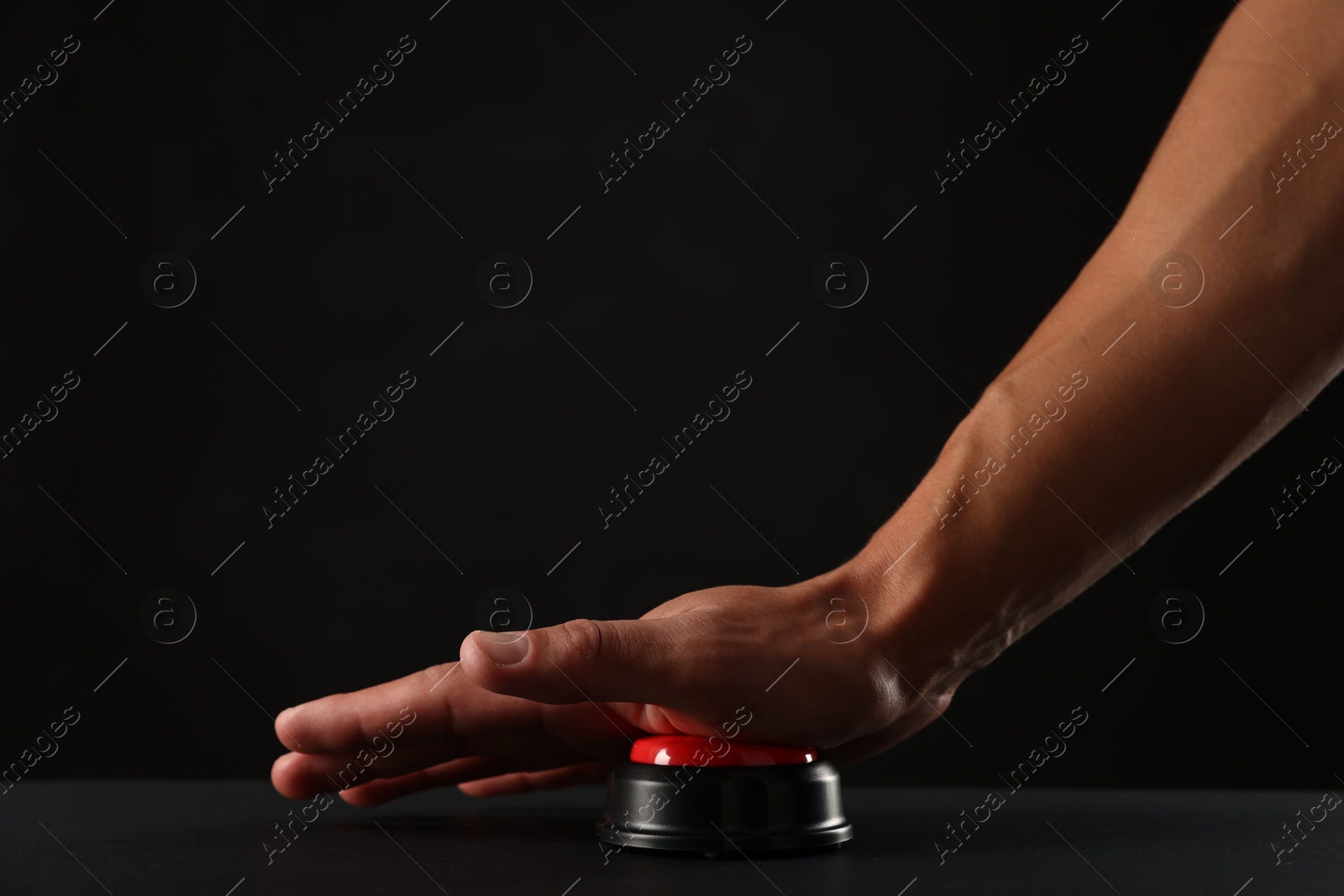 Man pressing button on black background, closeup. Space for text Photo of Man pressing button on black background, closeup. Space for text
