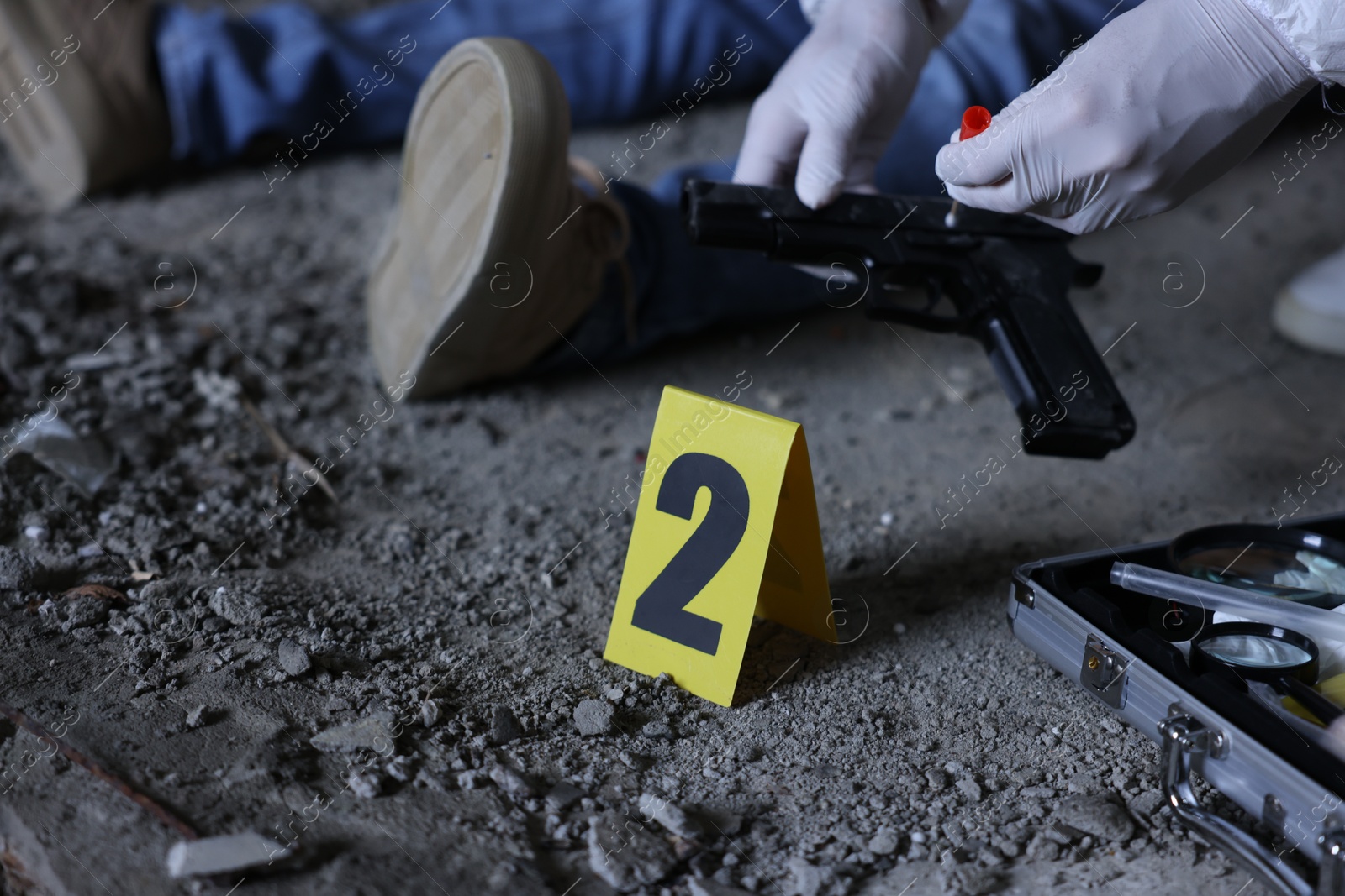 Forensic expert working at crime scene with dead body inside abandoned building, closeup Photo of Forensic expert working at crime scene with dead body inside abandoned building, closeup