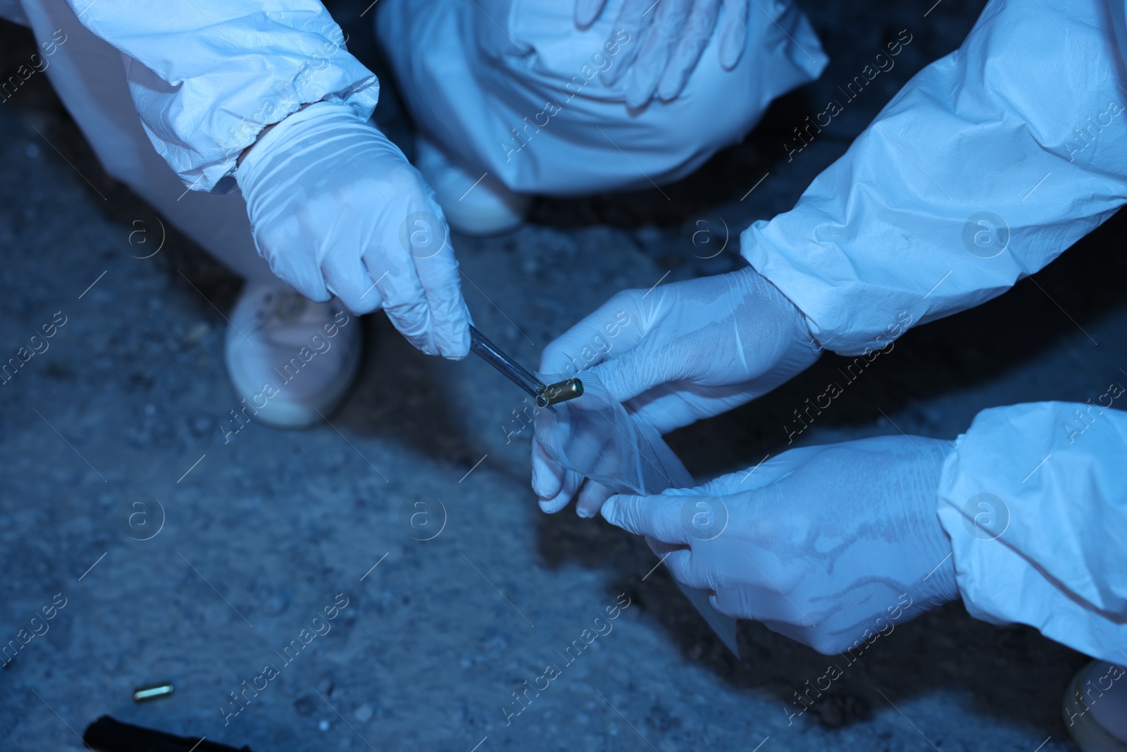 Forensic experts working at crime scene inside abandoned building, closeup Photo of Forensic experts working at crime scene inside abandoned building, closeup