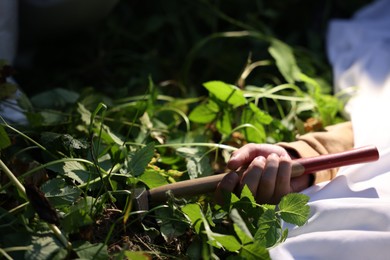 Photo of Forensic expertise. Crime scene with dead man's body and evidence outdoors, closeup