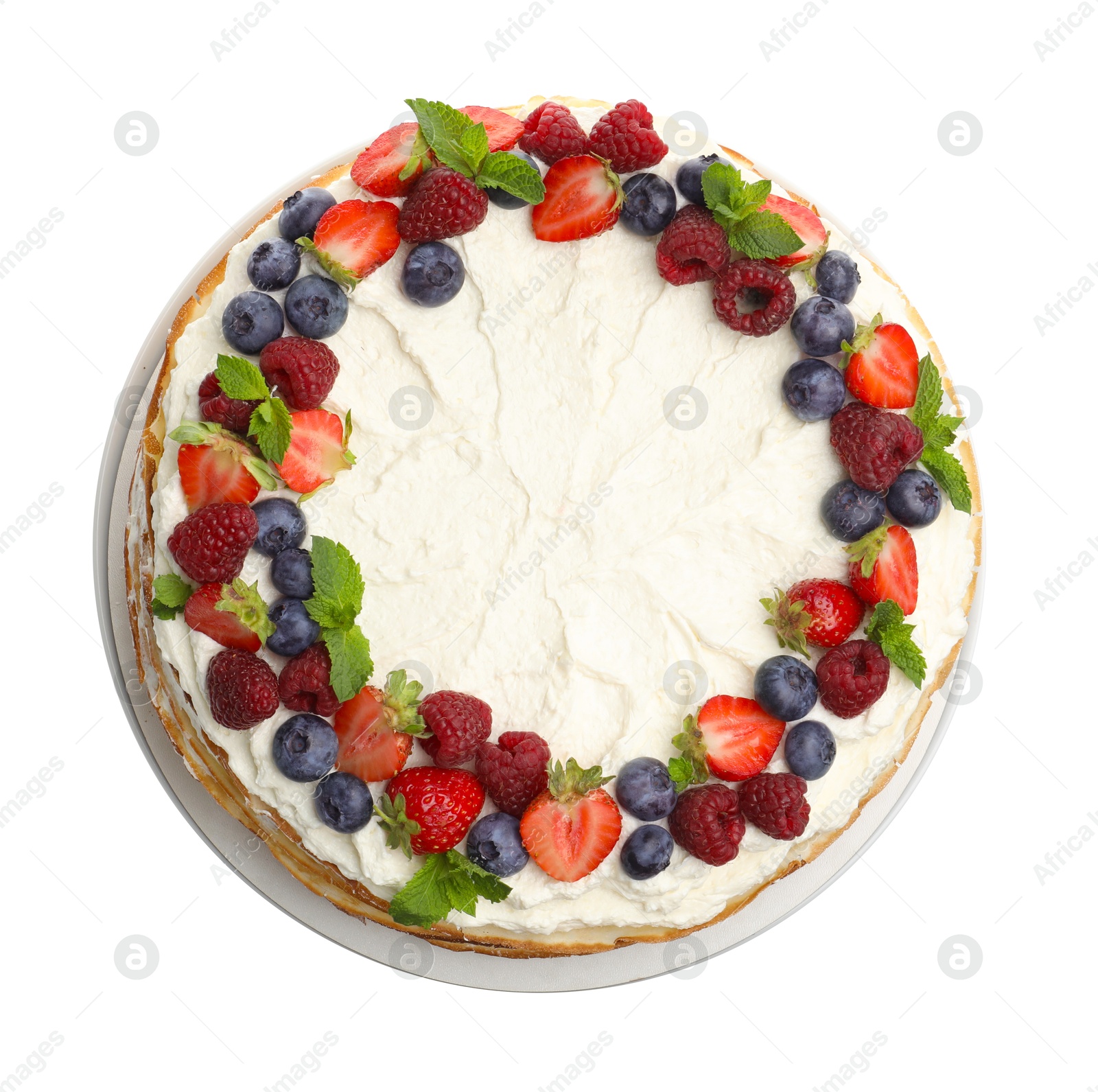 Photo of Delicious crepe cake with fresh berries isolated on white, top view