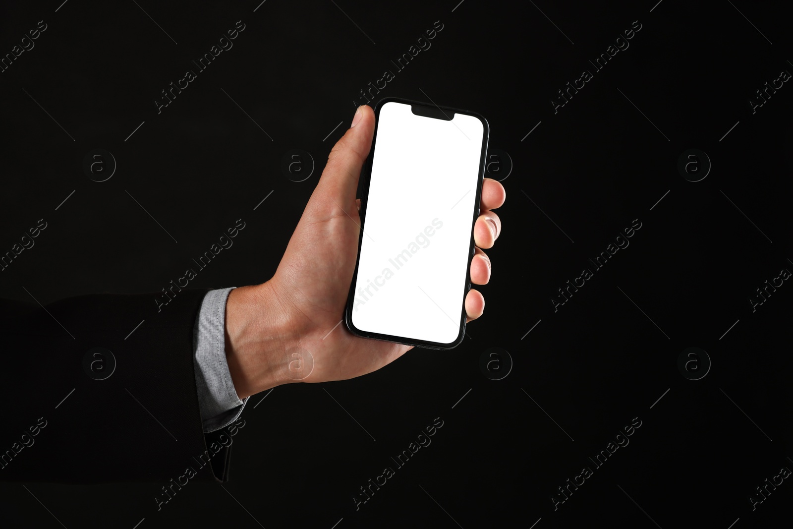 Man with modern smartphone on black background, closeup. Mockup for design Photo of Man with modern smartphone on black background, closeup. Mockup for design