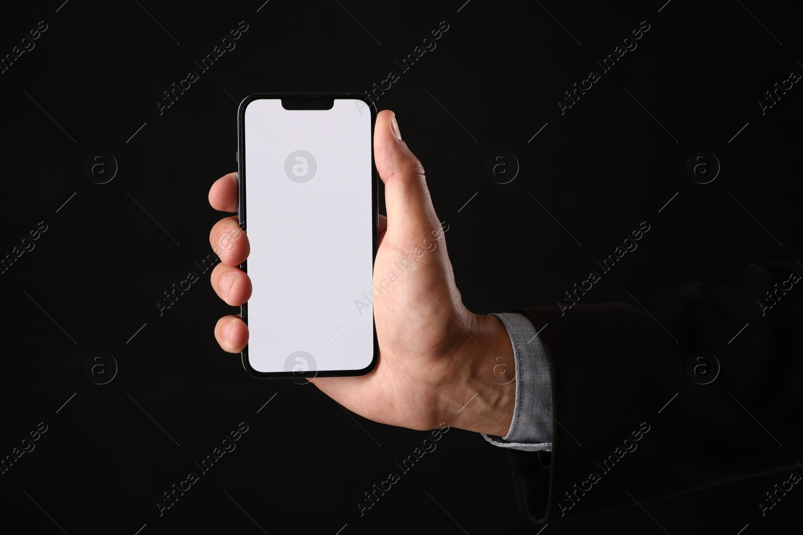 Man with modern smartphone on black background, closeup. Mockup for design Photo of Man with modern smartphone on black background, closeup. Mockup for design