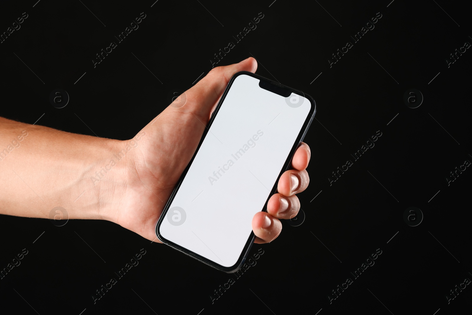 Man with modern smartphone on black background, closeup. Mockup for design Photo of Man with modern smartphone on black background, closeup. Mockup for design