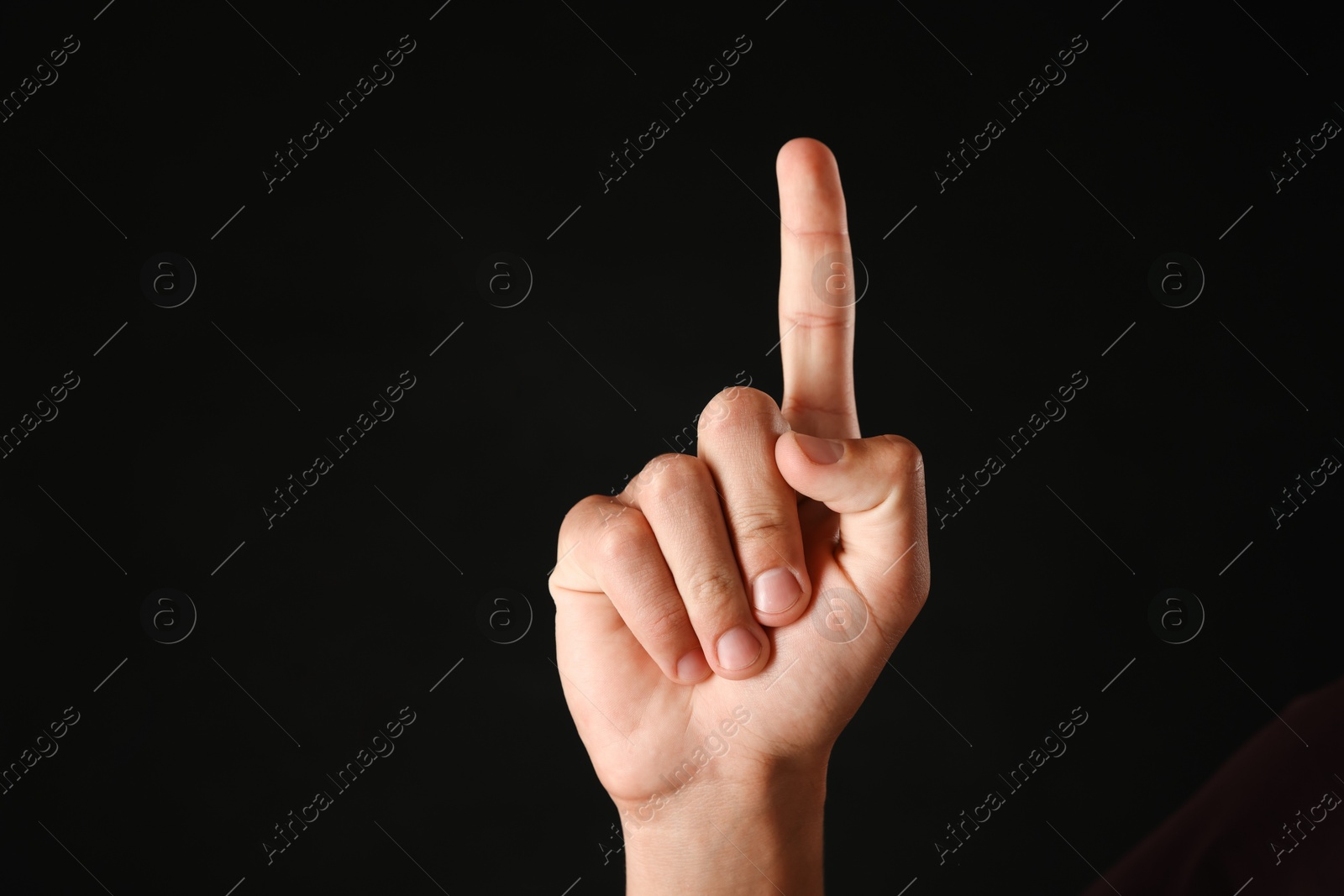 Man touching something on black background, closeup Photo of Man touching something on black background, closeup