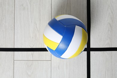 Photo of One volleyball ball on floor, top view. Space for text