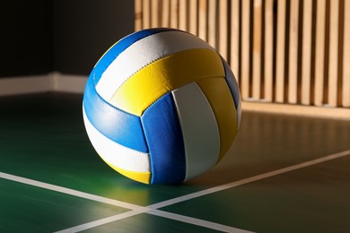 Photo of One volleyball ball on court, closeup. Sports equipment