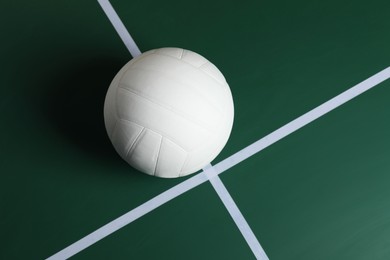 Photo of One volleyball ball on court, top view. Space for text