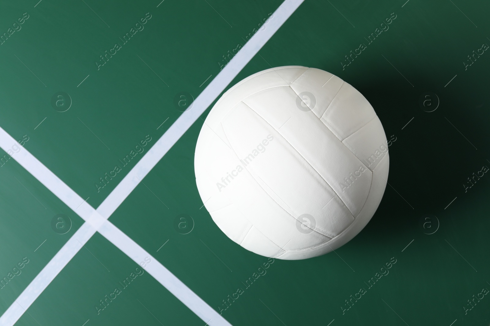 One volleyball ball on court, top view. Space for text Photo of One volleyball ball on court, top view. Space for text