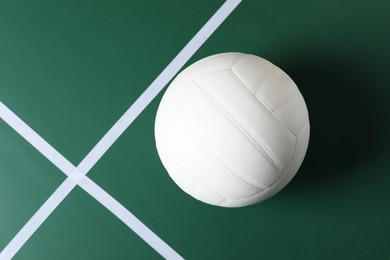 Photo of One volleyball ball on court, top view. Space for text