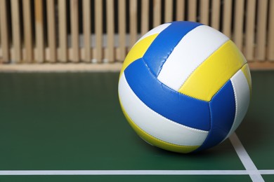 Photo of One volleyball ball on court, closeup. Space for text