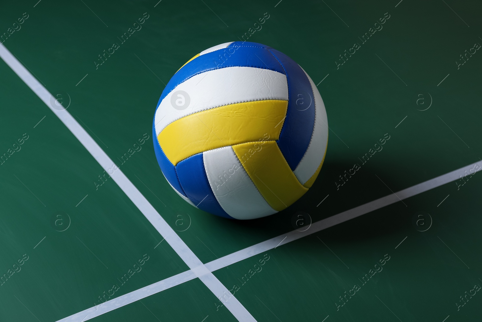 Photo of One volleyball ball on court. Sports equipment
