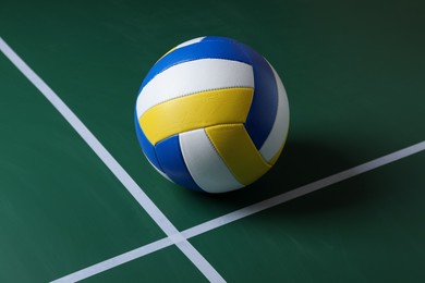 Photo of One volleyball ball on court. Sports equipment