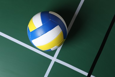 Photo of One volleyball ball on court, top view. Space for text
