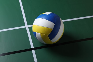 Photo of One volleyball ball on court. Sports equipment