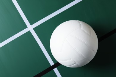 Photo of One volleyball ball on court, top view. Space for text