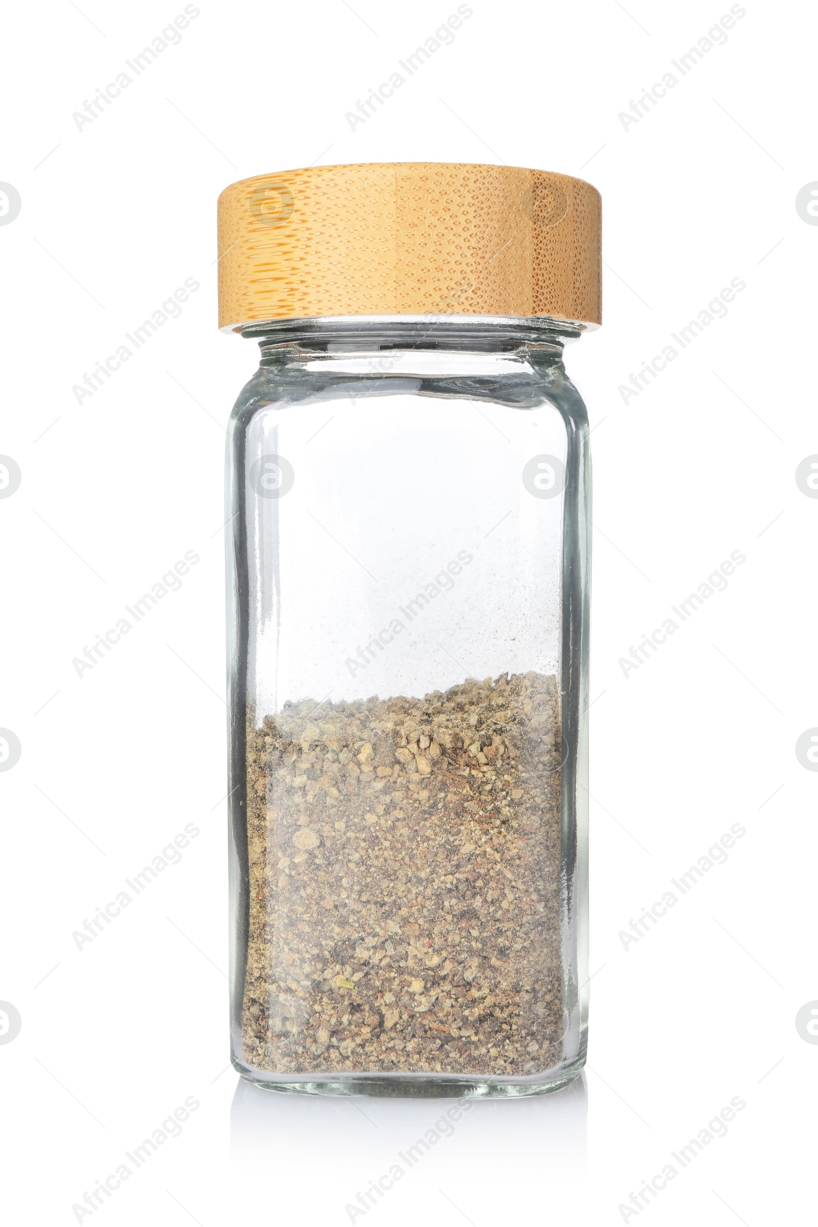 Photo of Ground black pepper in glass jar isolated on white. Aromatic spice