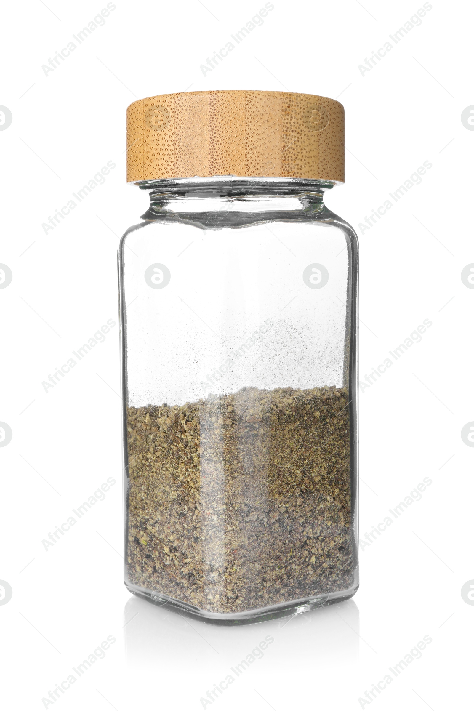 Photo of Ground black pepper in glass jar isolated on white. Aromatic spice
