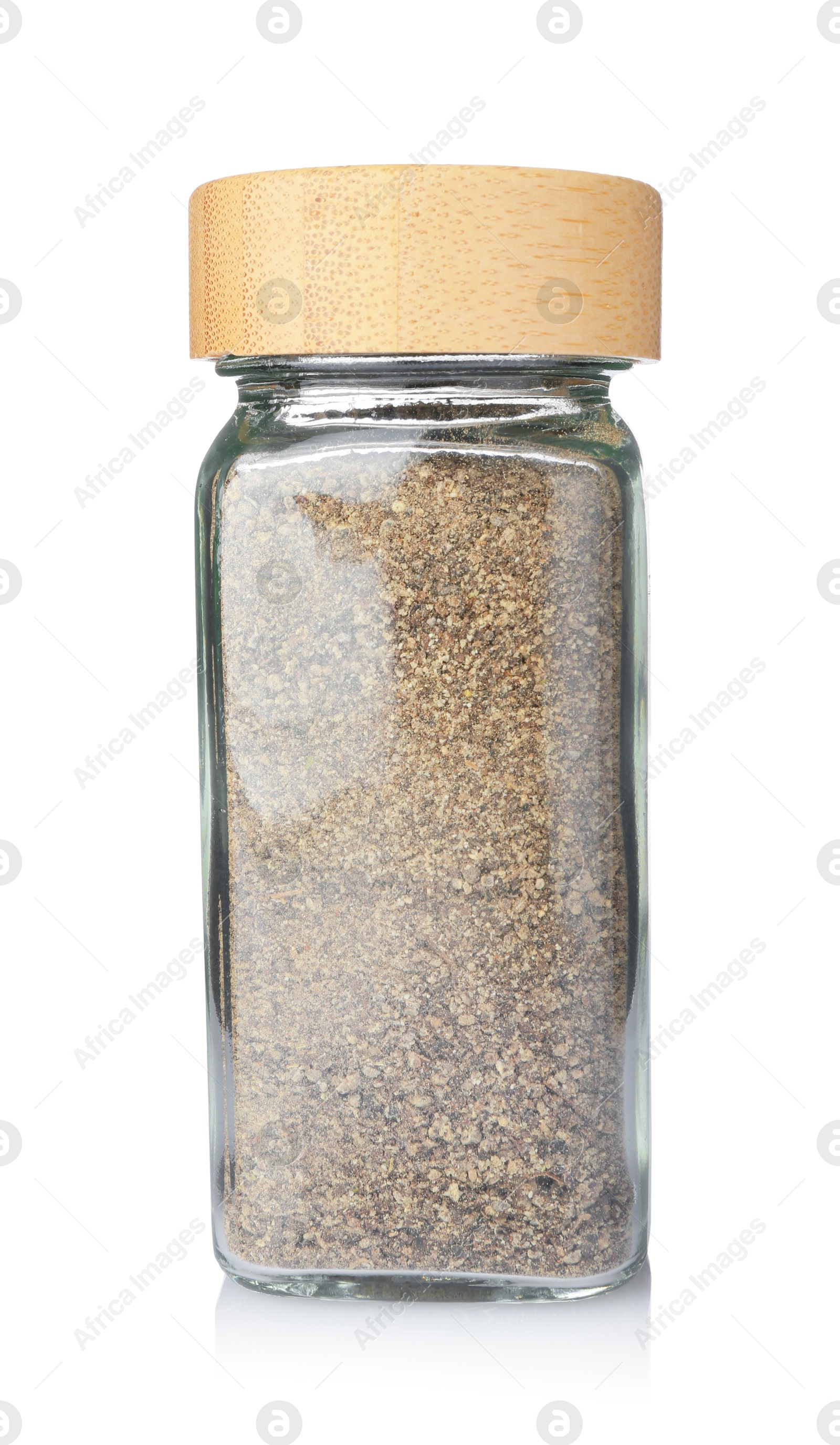 Photo of Ground black pepper in glass jar isolated on white. Aromatic spice