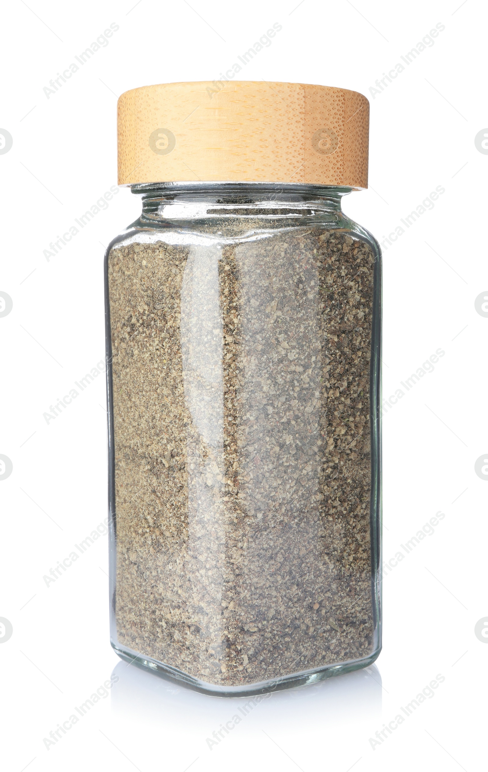 Photo of Ground black pepper in glass jar isolated on white. Aromatic spice