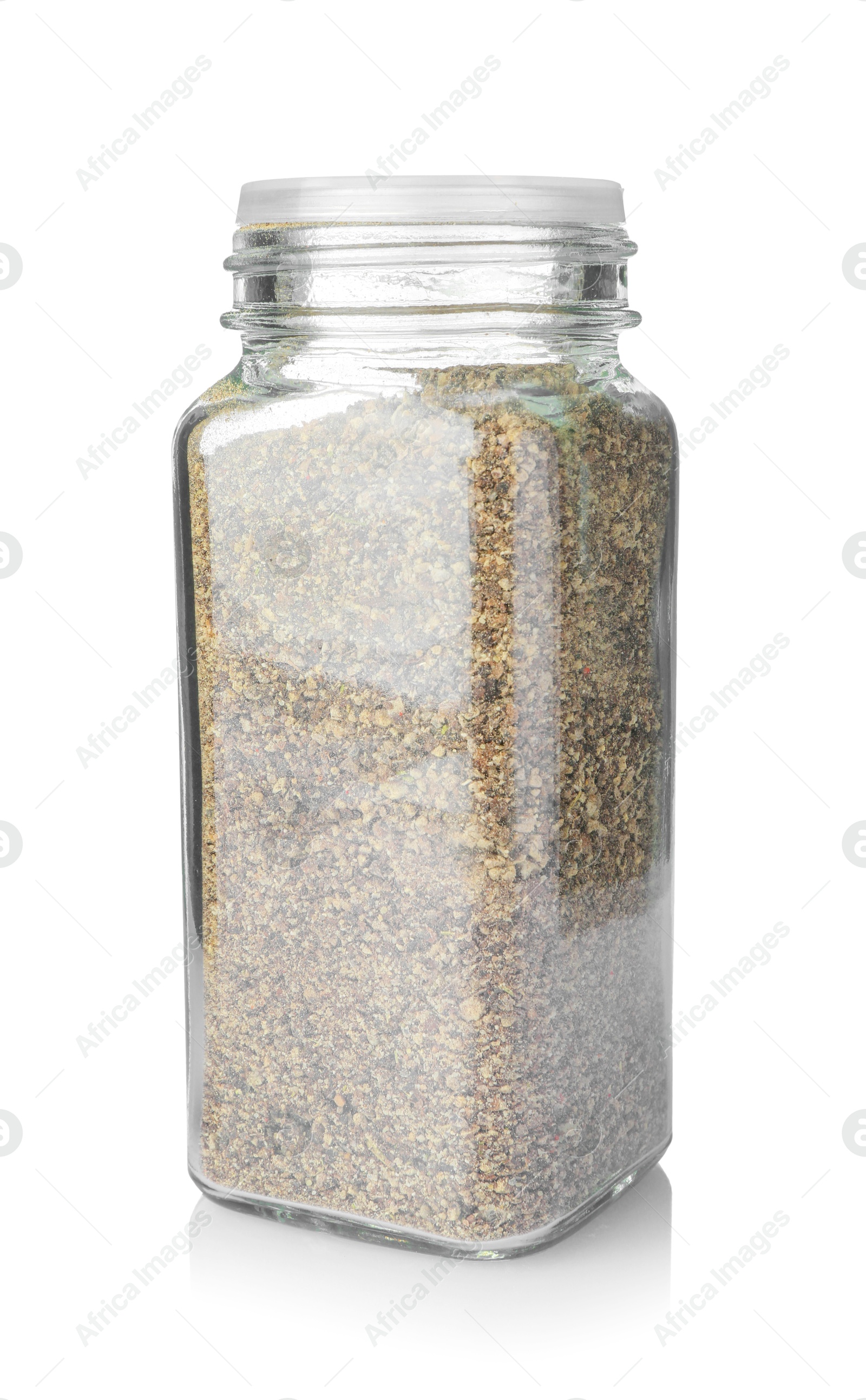 Photo of Ground black pepper in glass jar isolated on white. Aromatic spice
