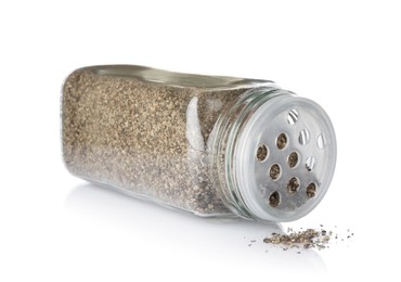 Photo of Ground black pepper in glass jar isolated on white. Aromatic spice