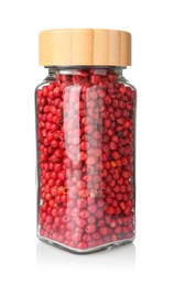 Photo of Red peppercorns in glass jar isolated on white. Aromatic spice