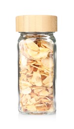 Photo of Dried garlic flakes in glass jar isolated on white. Aromatic spice