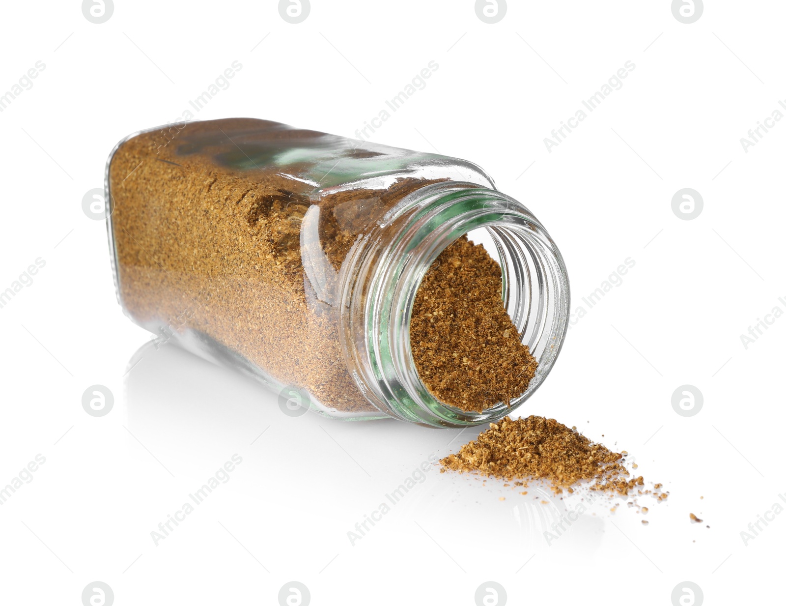 Photo of Ground caraway (Persian cumin) in glass jar isolated on white. Aromatic spice