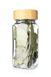 Photo of Dried bay leaves in glass jar isolated on white. Aromatic spice