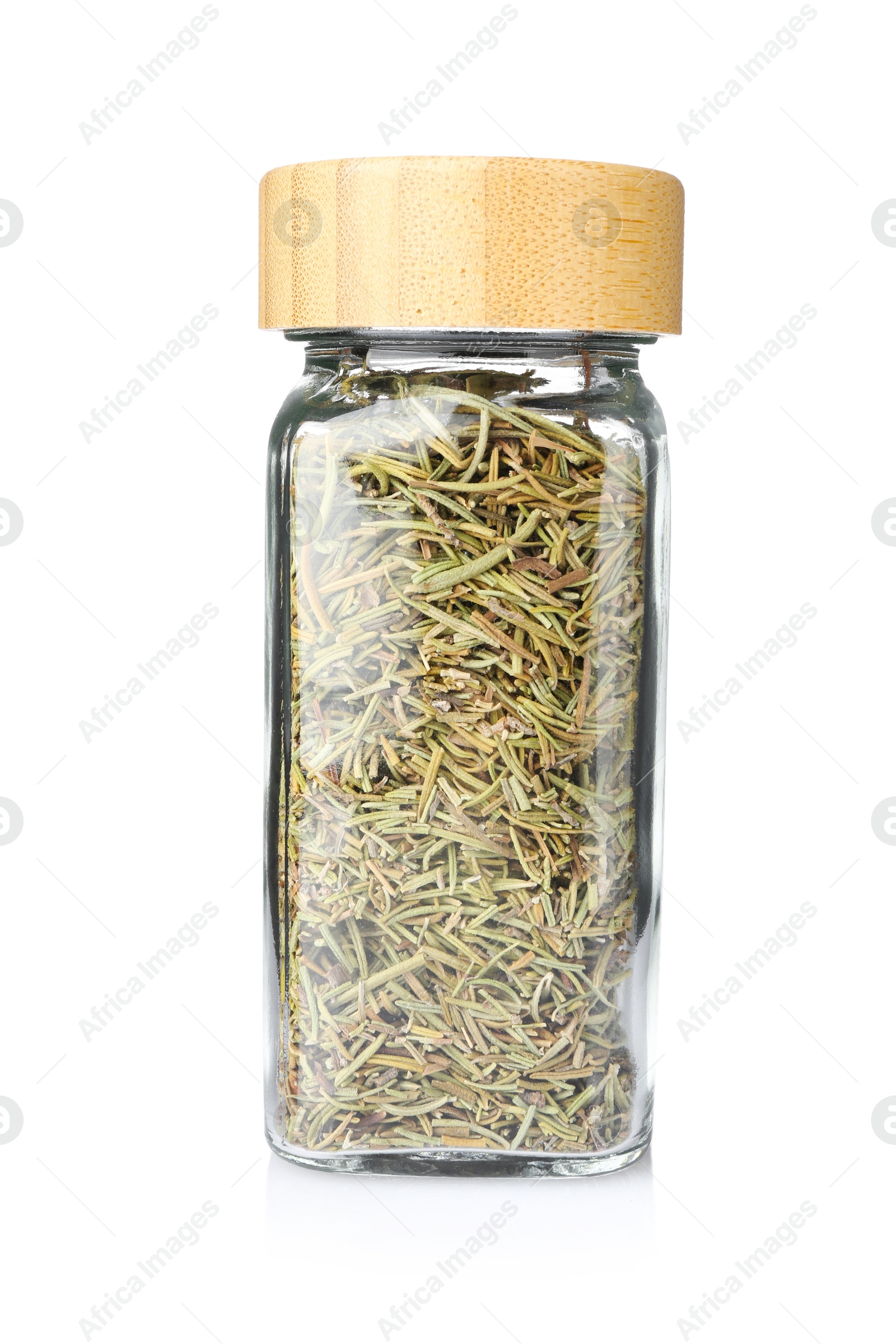 Photo of Dried rosemary in glass jar isolated on white. Aromatic spice