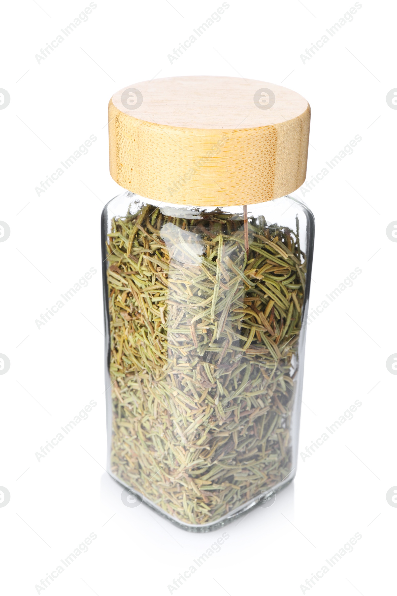 Photo of Dried rosemary in glass jar isolated on white. Aromatic spice