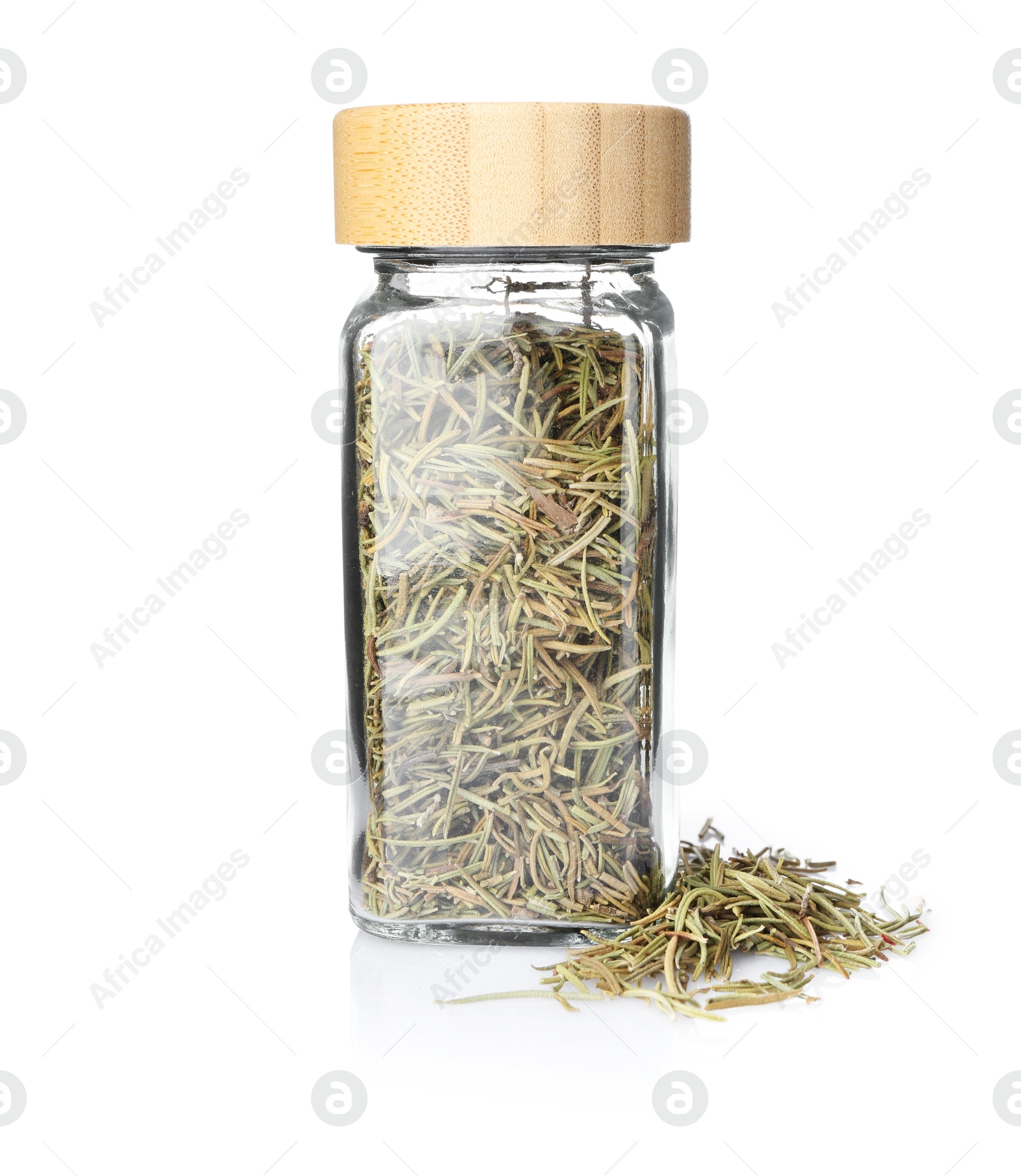Photo of Dried rosemary in glass jar isolated on white. Aromatic spice