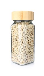 Photo of Peppercorns in glass jar isolated on white. Aromatic spice