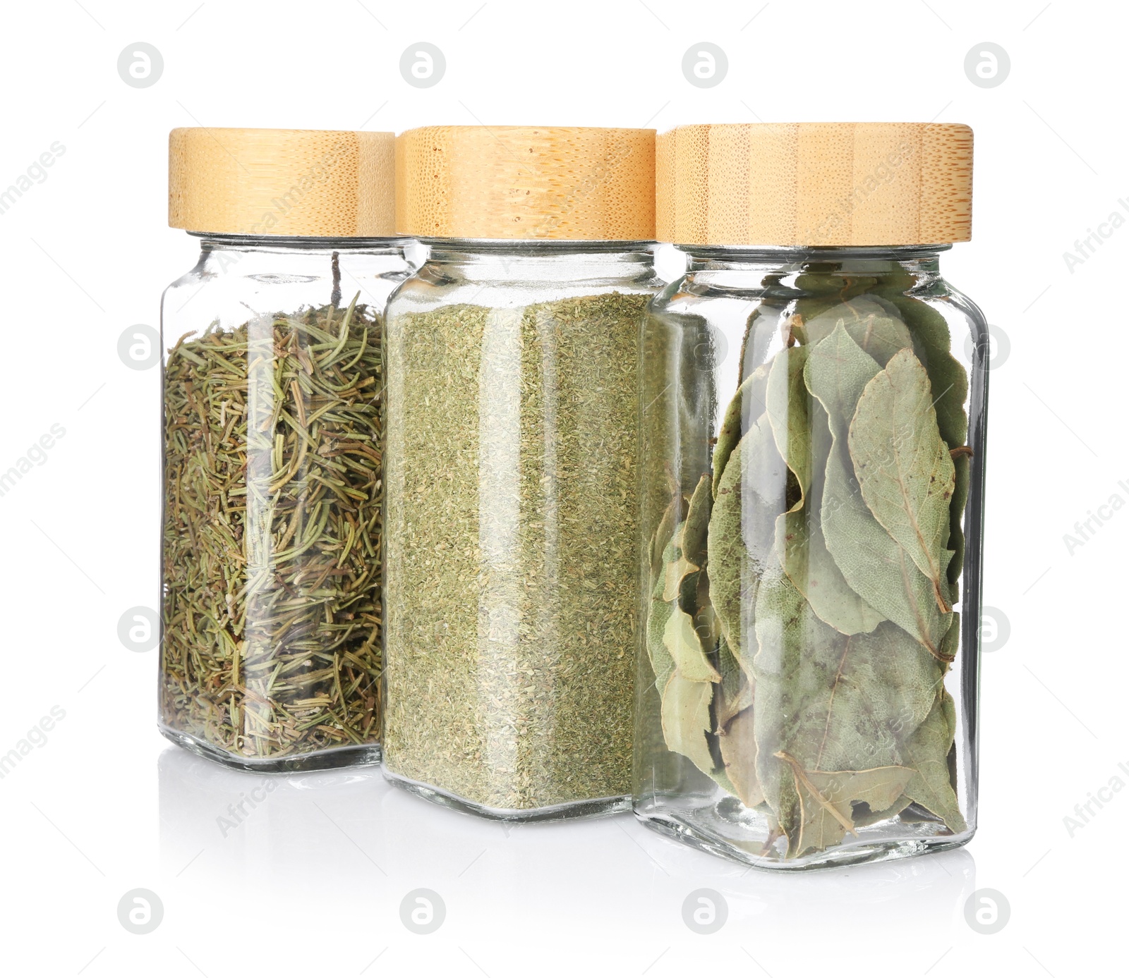 Different aromatic spices in glass jars isolated on white Photo of Different aromatic spices in glass jars isolated on white