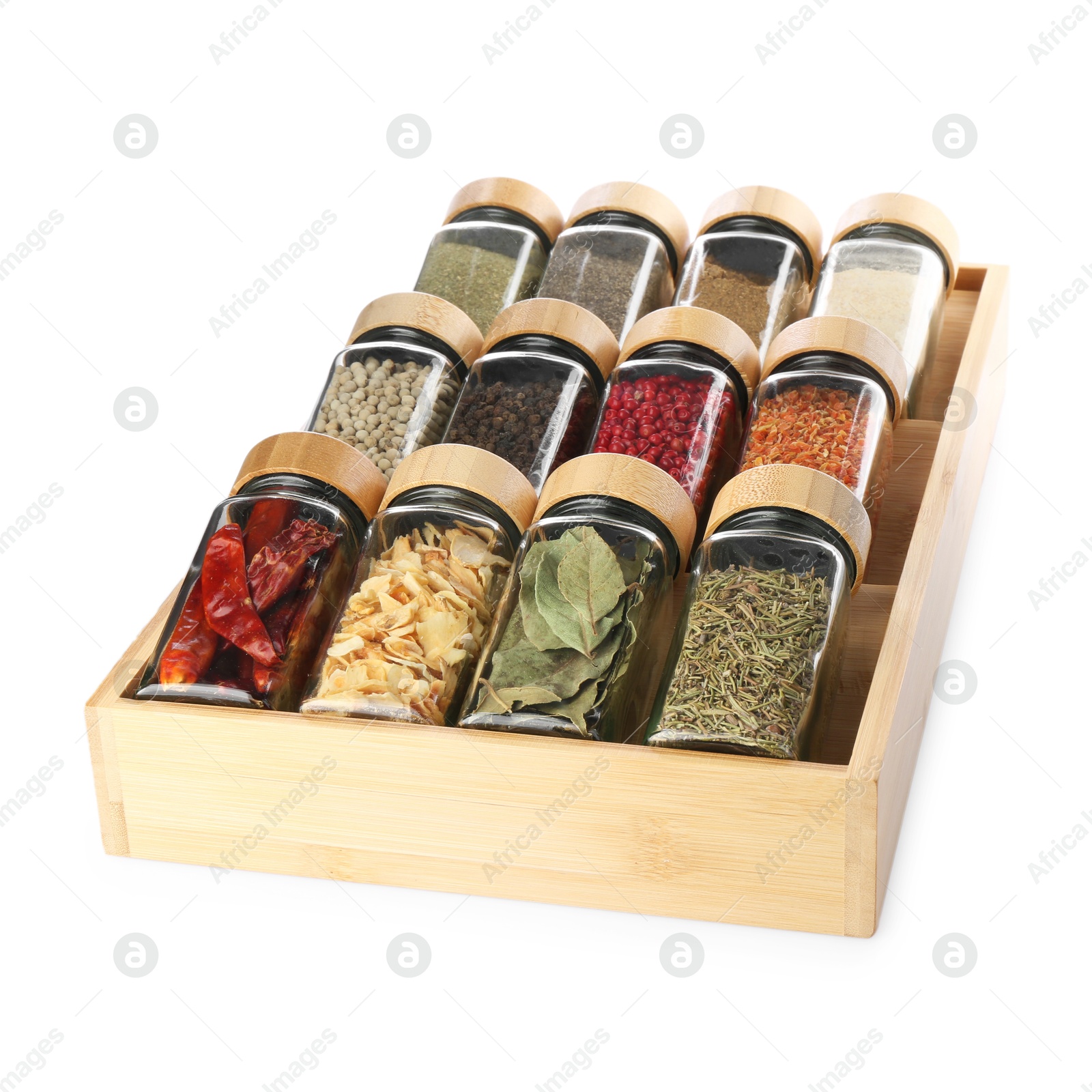 Photo of Different aromatic spices in glass jars isolated on white