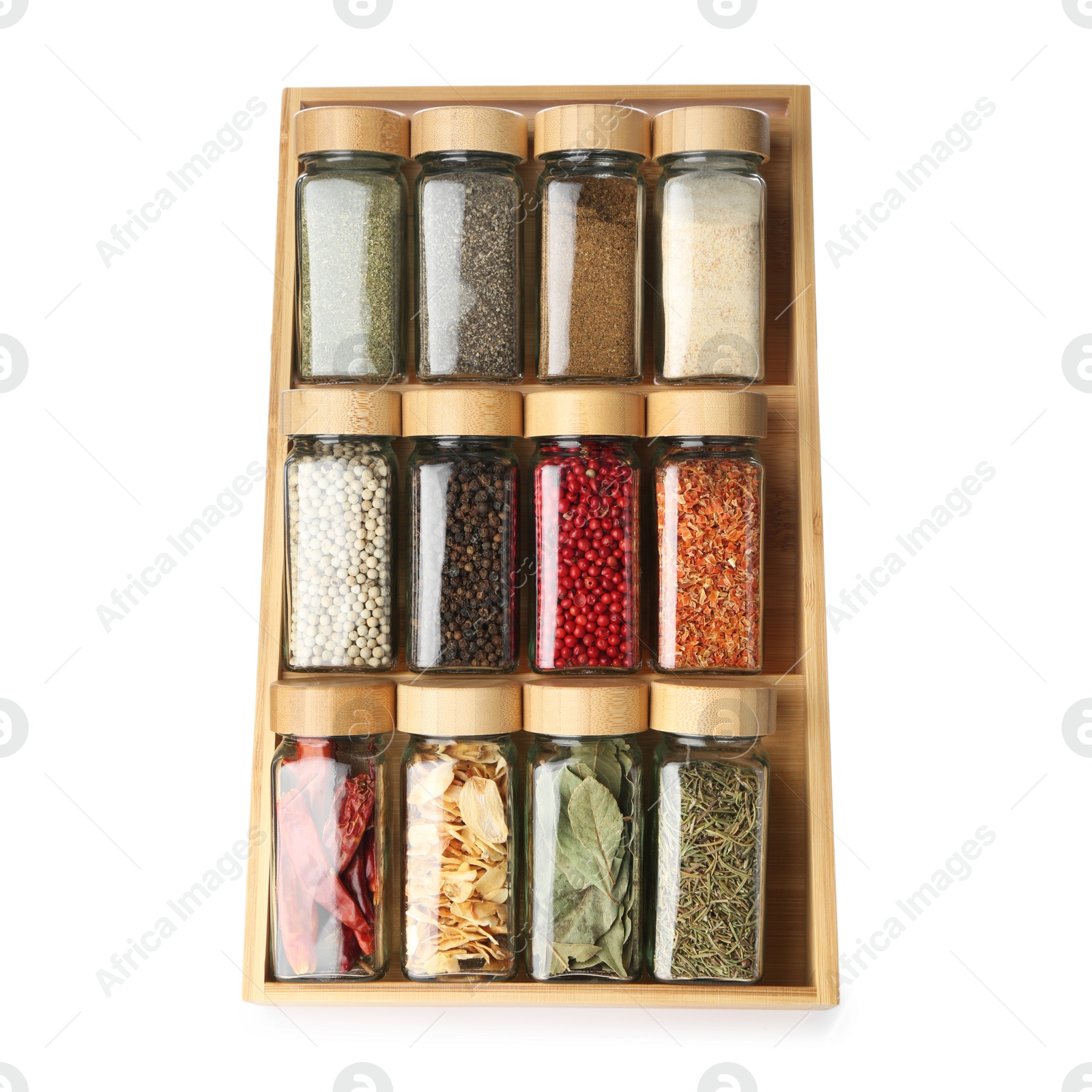Photo of Different aromatic spices in glass jars isolated on white, top view
