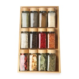 Photo of Different aromatic spices in glass jars isolated on white, top view