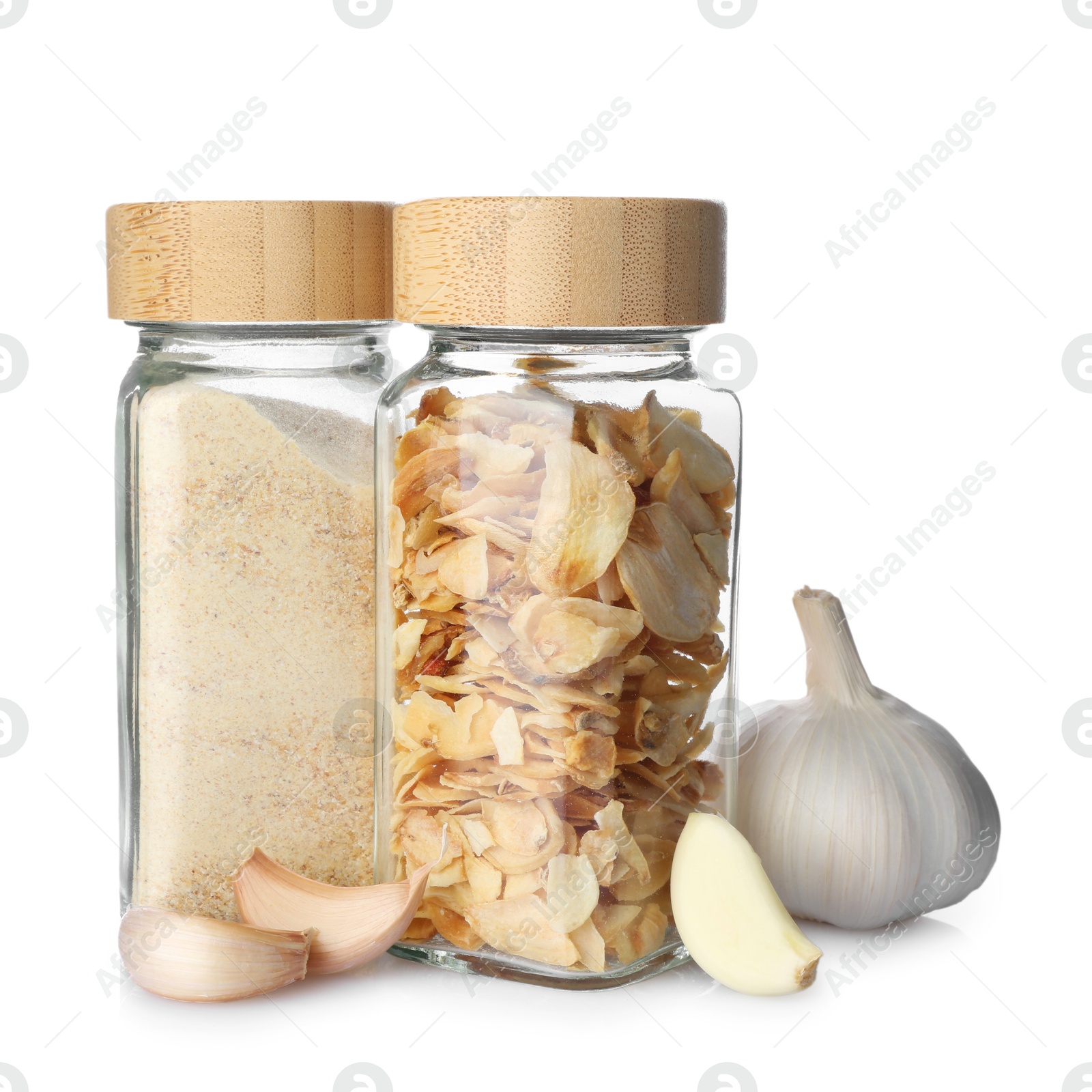 Photo of Fresh garlic, dried flakes and powder isolated on white