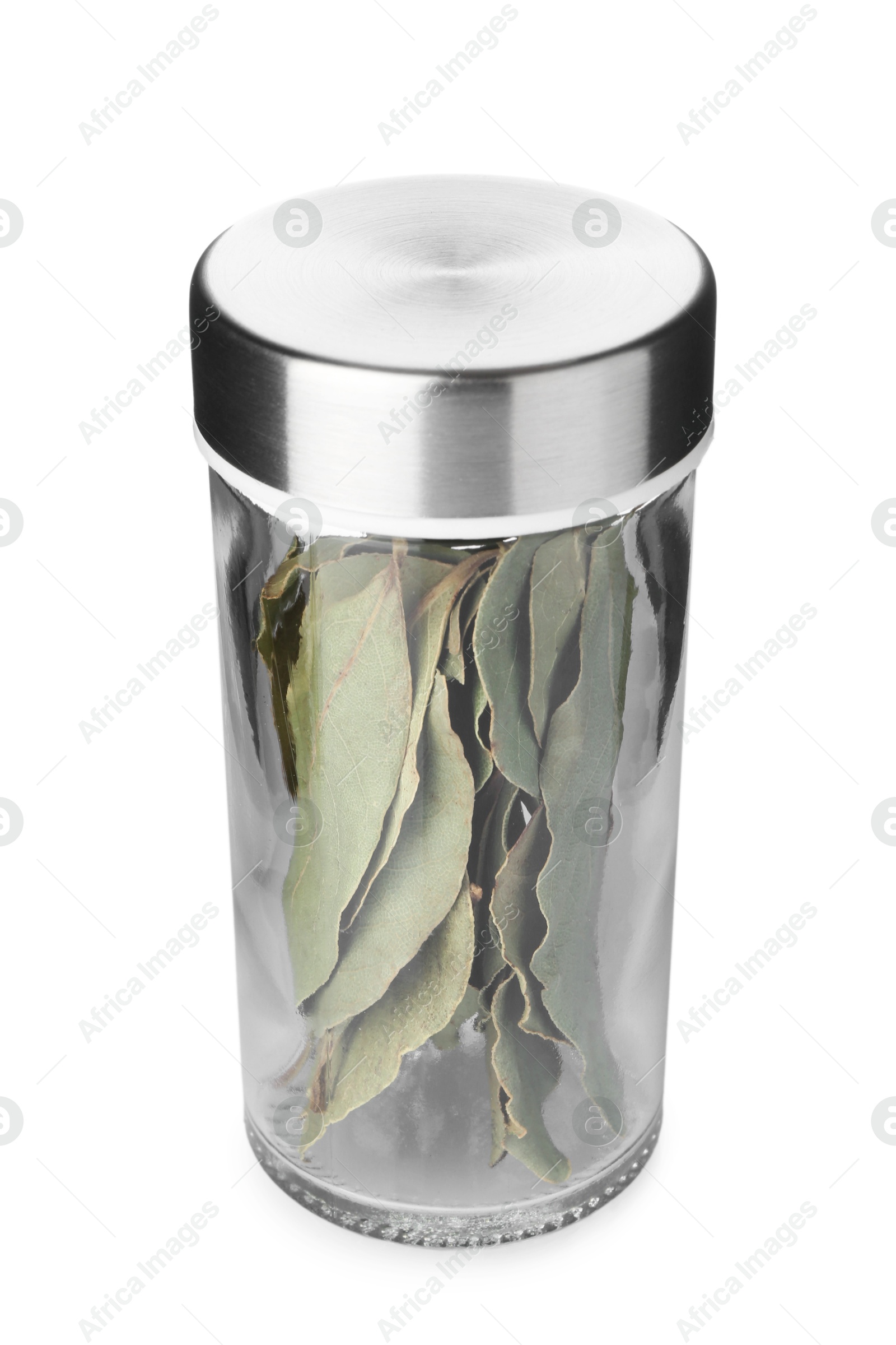 Photo of Dried bay leaves in spice jar isolated on white