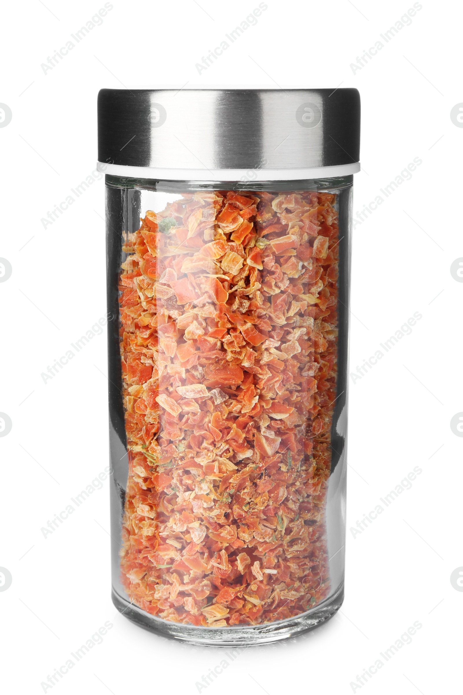 Photo of Dried carrot flakes in spice jar isolated on white
