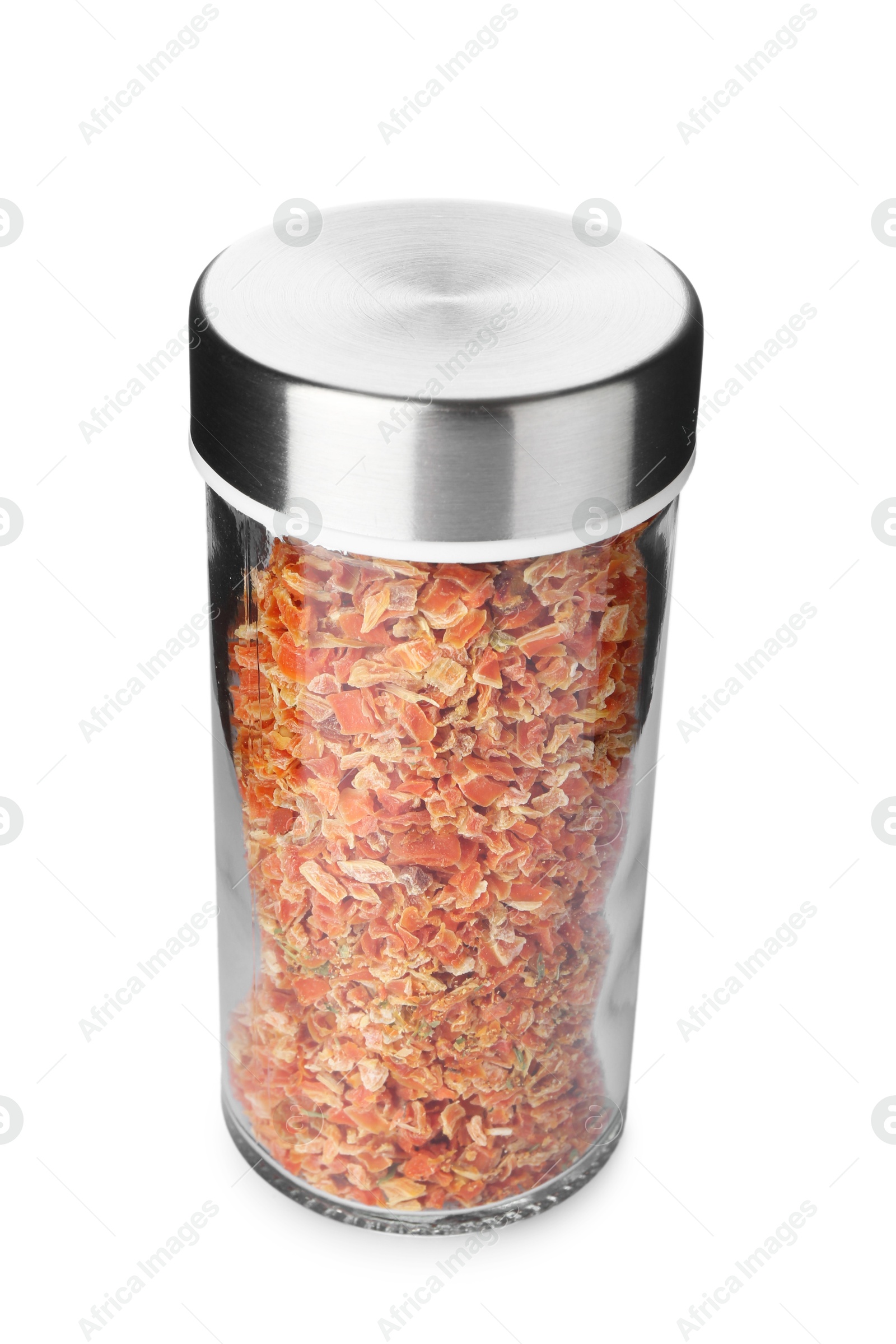 Photo of Dried carrot flakes in spice jar isolated on white
