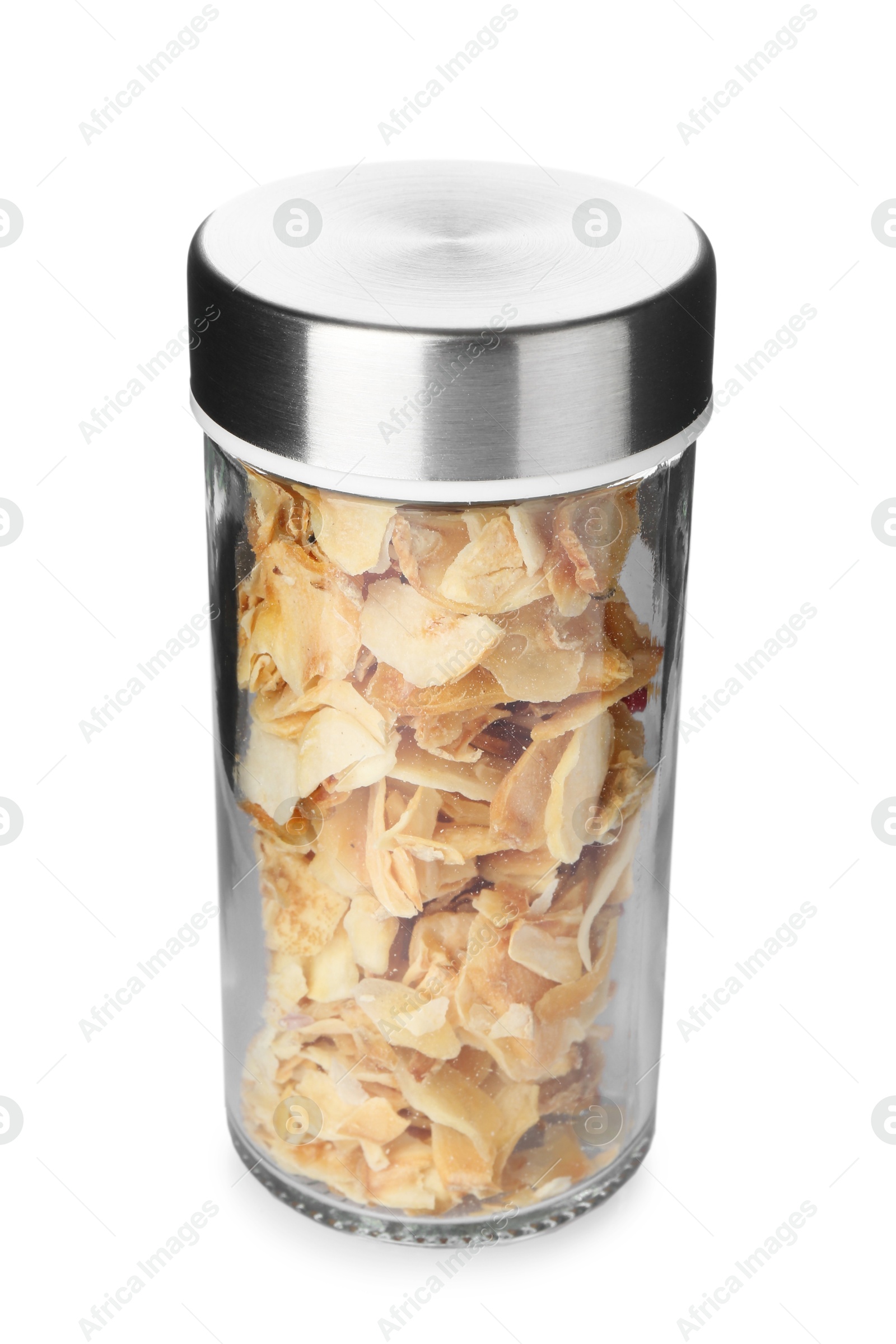 Photo of Dried garlic flakes in spice jar isolated on white