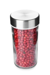 Photo of Red peppercorns in spice jar isolated on white