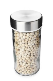 Photo of Peppercorns in spice jar isolated on white