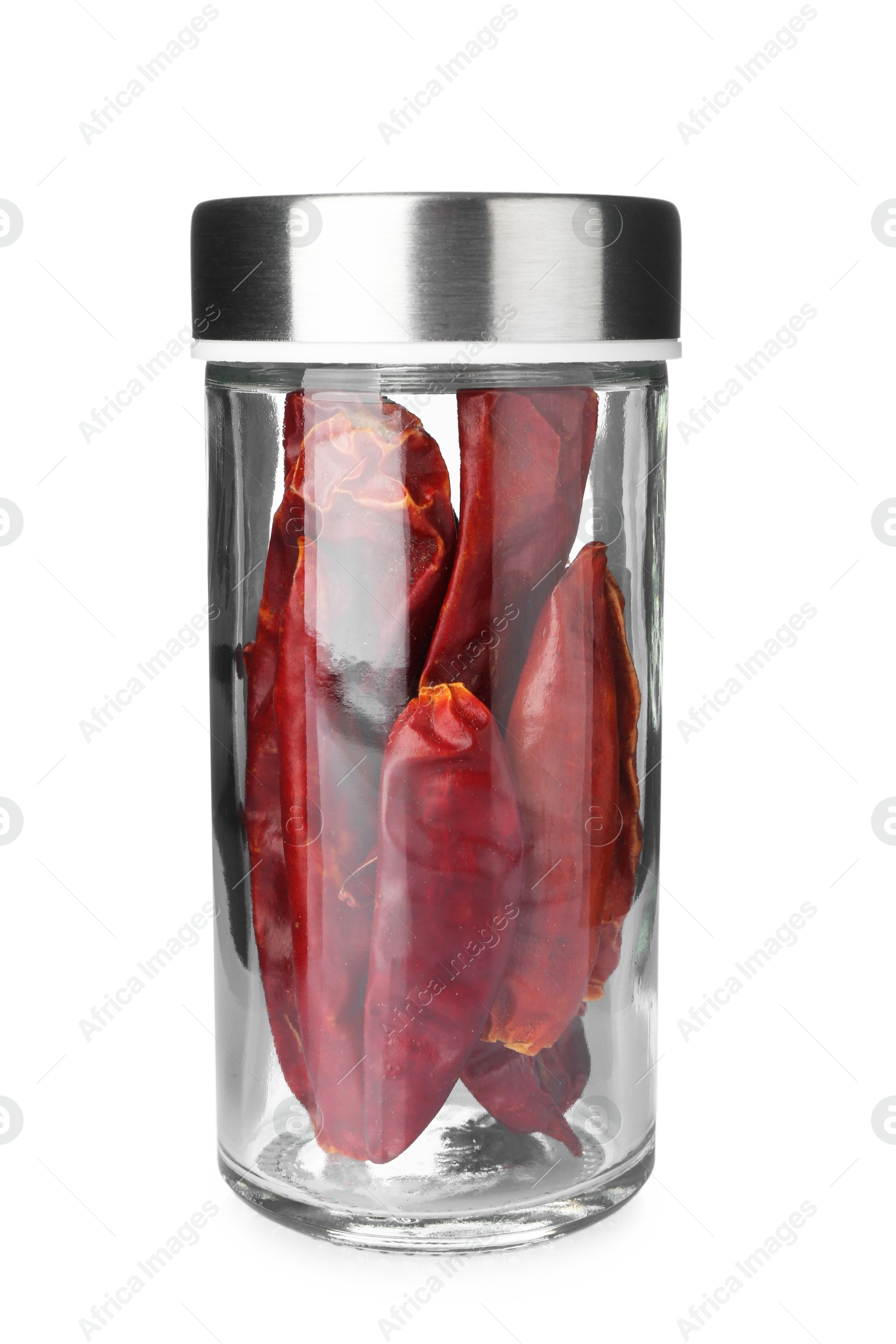 Photo of Chili peppers in spice jar isolated on white