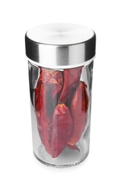 Photo of Chili peppers in spice jar isolated on white