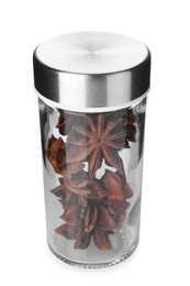 Photo of Anise stars in spice jar isolated on white