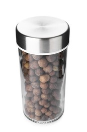 Photo of Allspice peppercorns in spice jar isolated on white