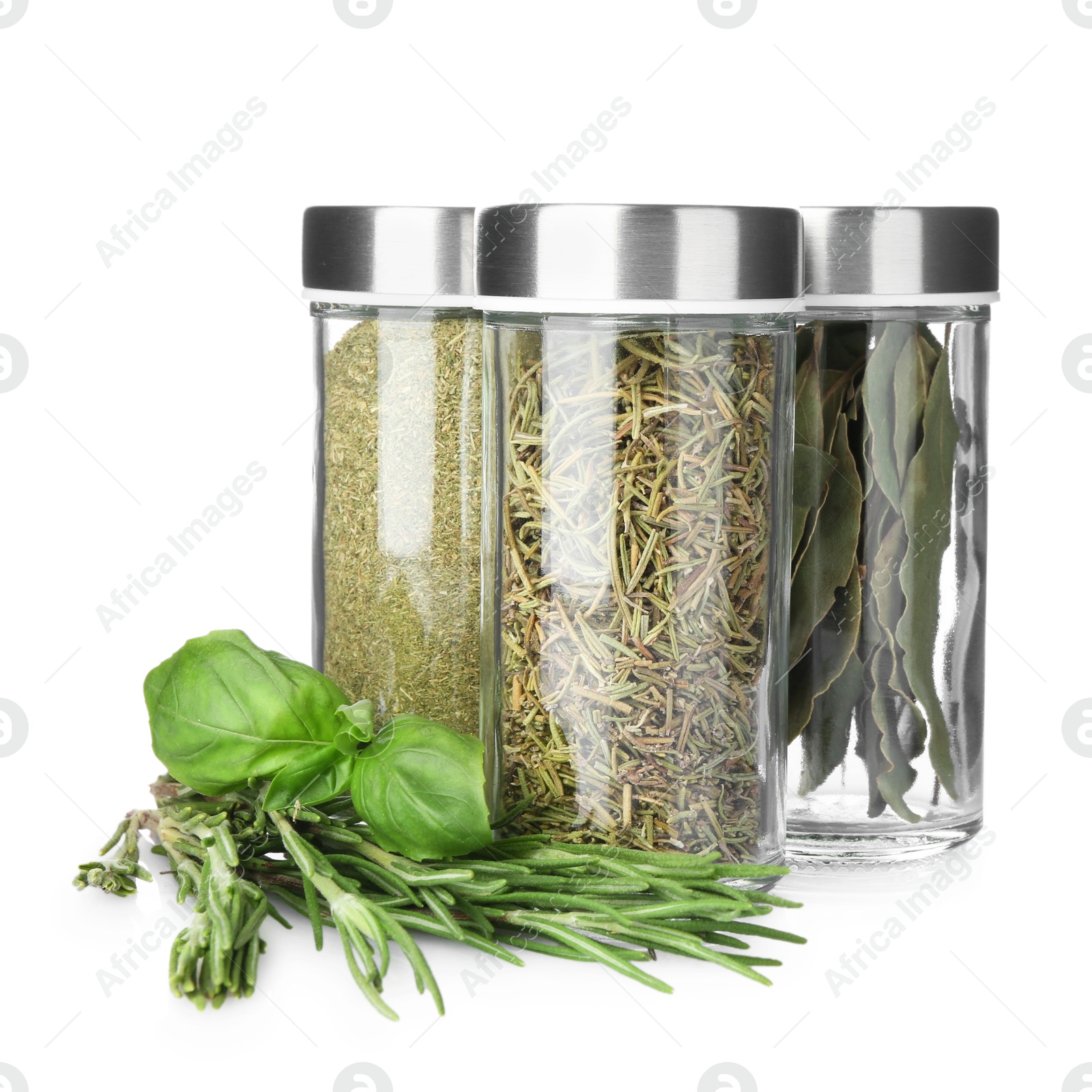 Photo of Many different aromatic spices in jars isolated on white